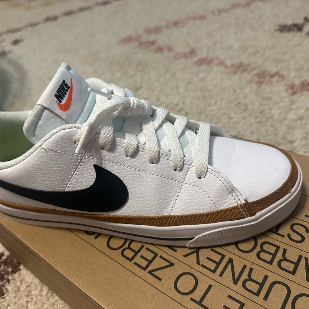 Nike White and gold Sneakers with Black Swoosh